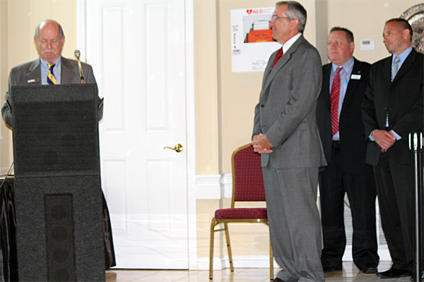 Secretary, Bob Lyke, making brief resentation to Jim Nillson with Sean Millane and Paul Delskey  on the right.